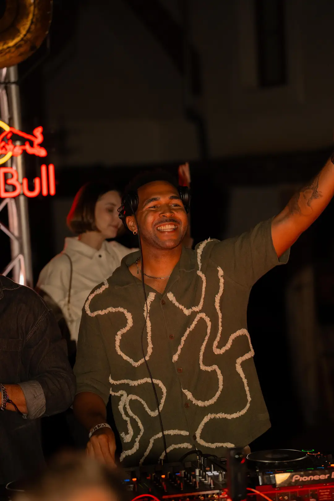SEKOU smiling at the decks at night